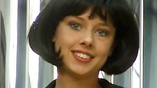 Brunette hottie with short hair spreads her pussy and fingers it for the camera