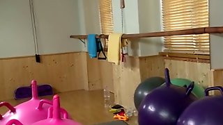 She\'s is riding an exercise ball.